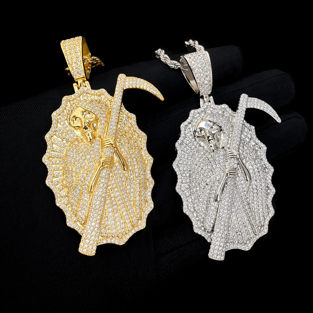 Luxury iced-out Grim Reaper pendant with pavé-set stones and polished silver-tone accents, photographed in a high-end studio setting.